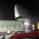 The satellite is completely out of the C-5 as its convoy prepares to depart.